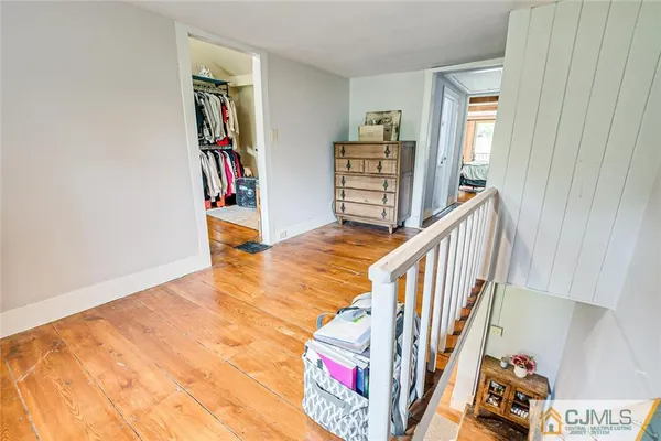 a view of an entryway with wooden floor