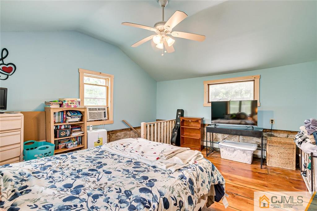 100 Mitchell Road Port Murray, NJ 07865 - Photo 32 of 48 a bedroom with a bed and a flat screen tv