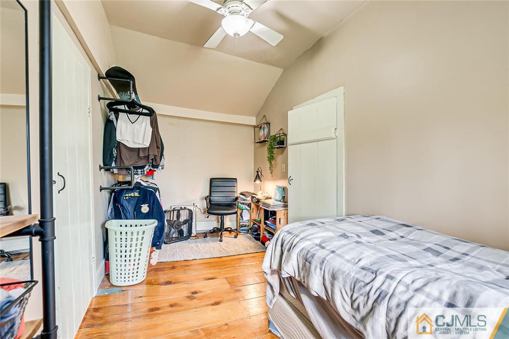 100 Mitchell Road Port Murray, NJ 07865 - Photo 35 of 48 a bedroom with a bed and a chandelier