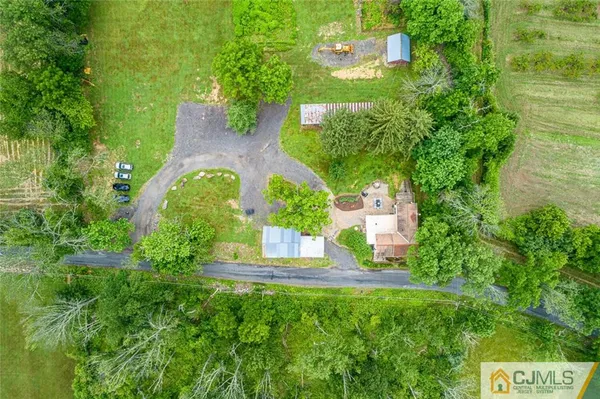 an aerial view of a house with outdoor space and street view