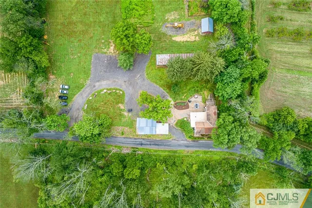 an aerial view of a house with outdoor space and street view