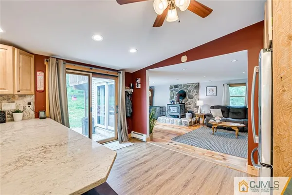 a view of a livingroom with furniture and a large window