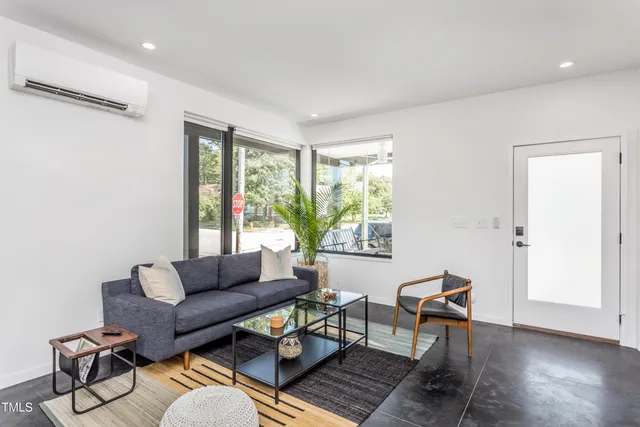 a living room with furniture and a window