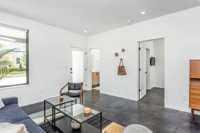 a living room with furniture and a window