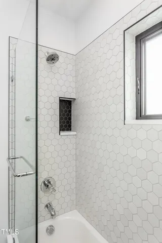 a bathroom with a shower and a toilet