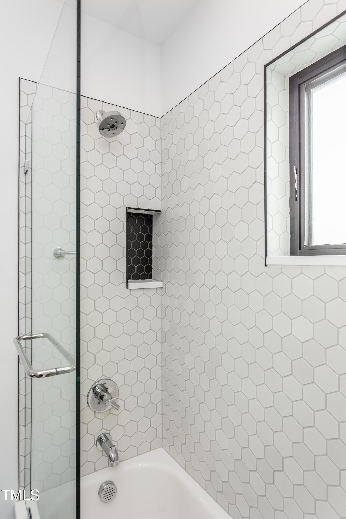 123 Idlewild Avenue, Unit 101 Raleigh, NC 27601 - Photo 26 of 27 a bathroom with a shower and a toilet