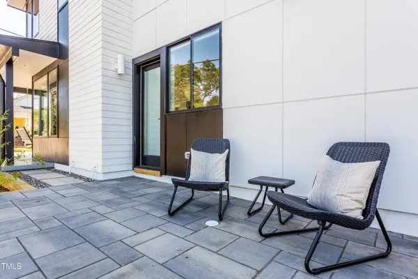 a view of a chairs and table in a patio
