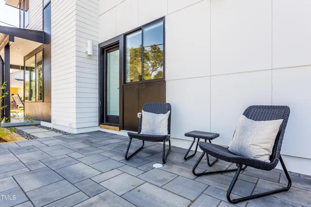 a view of a chairs and table in a patio