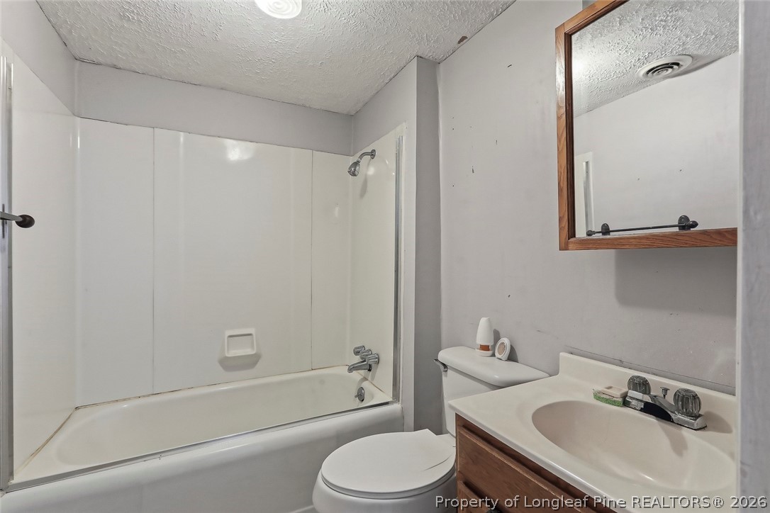 249 Nicholson Road Rockingham, NC 28379 - Photo 26 of 47 a bathroom with a sink toilet and shower