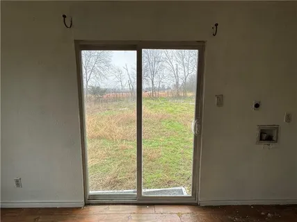 a view of a room that has a large window