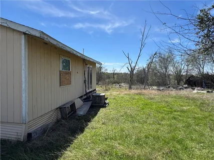 a backyard of a house with lots of green space