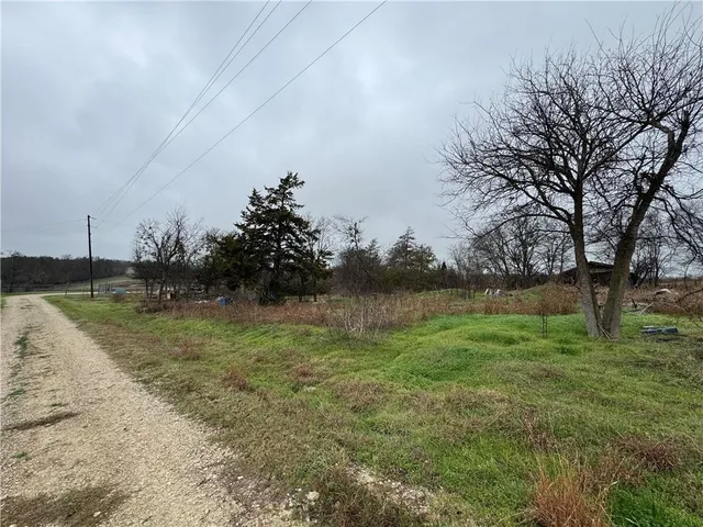 a backyard of a house with lots of green space
