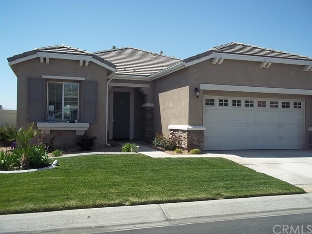 10562 Bridge Haven Road Apple Valley, CA 92308 - Photo 1 of 1 a front view of a house with a yard