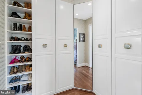 a bathroom with a double vanity sink mirror and shower