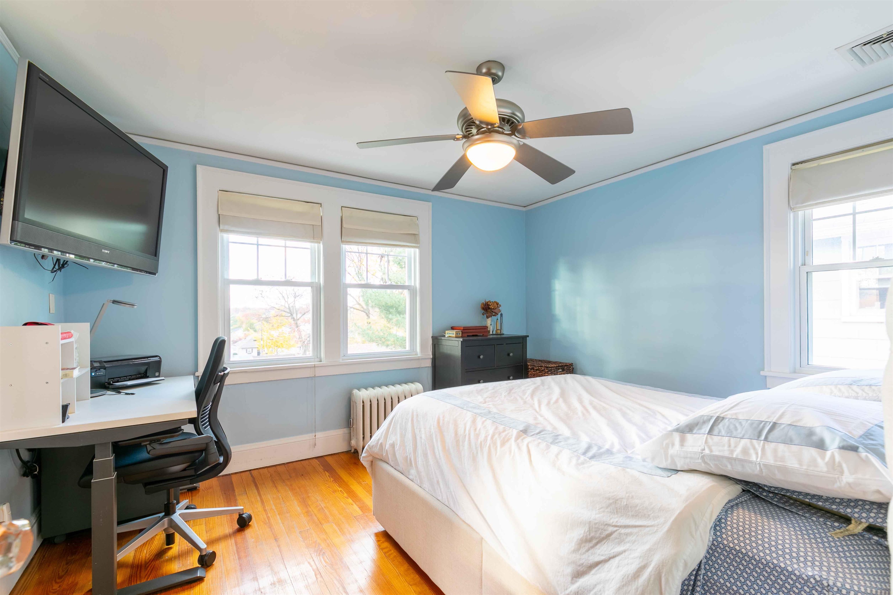 78 Jackson Avenue Rutherford, NJ 07070 - Photo 18 of 36 a bedroom with a bed and a flat screen tv
