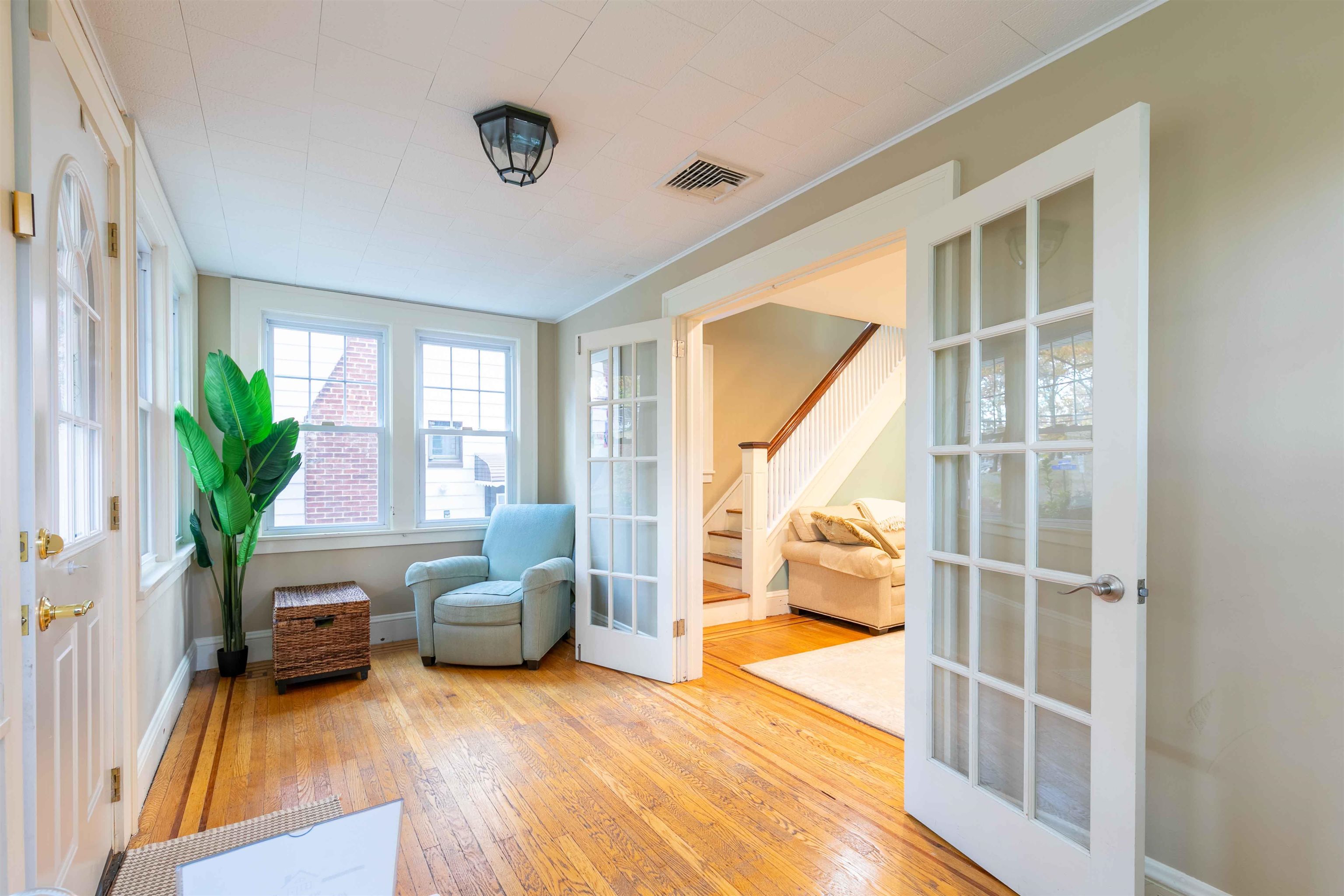 78 Jackson Avenue Rutherford, NJ 07070 - Photo 3 of 36 a living room with furniture and a large window