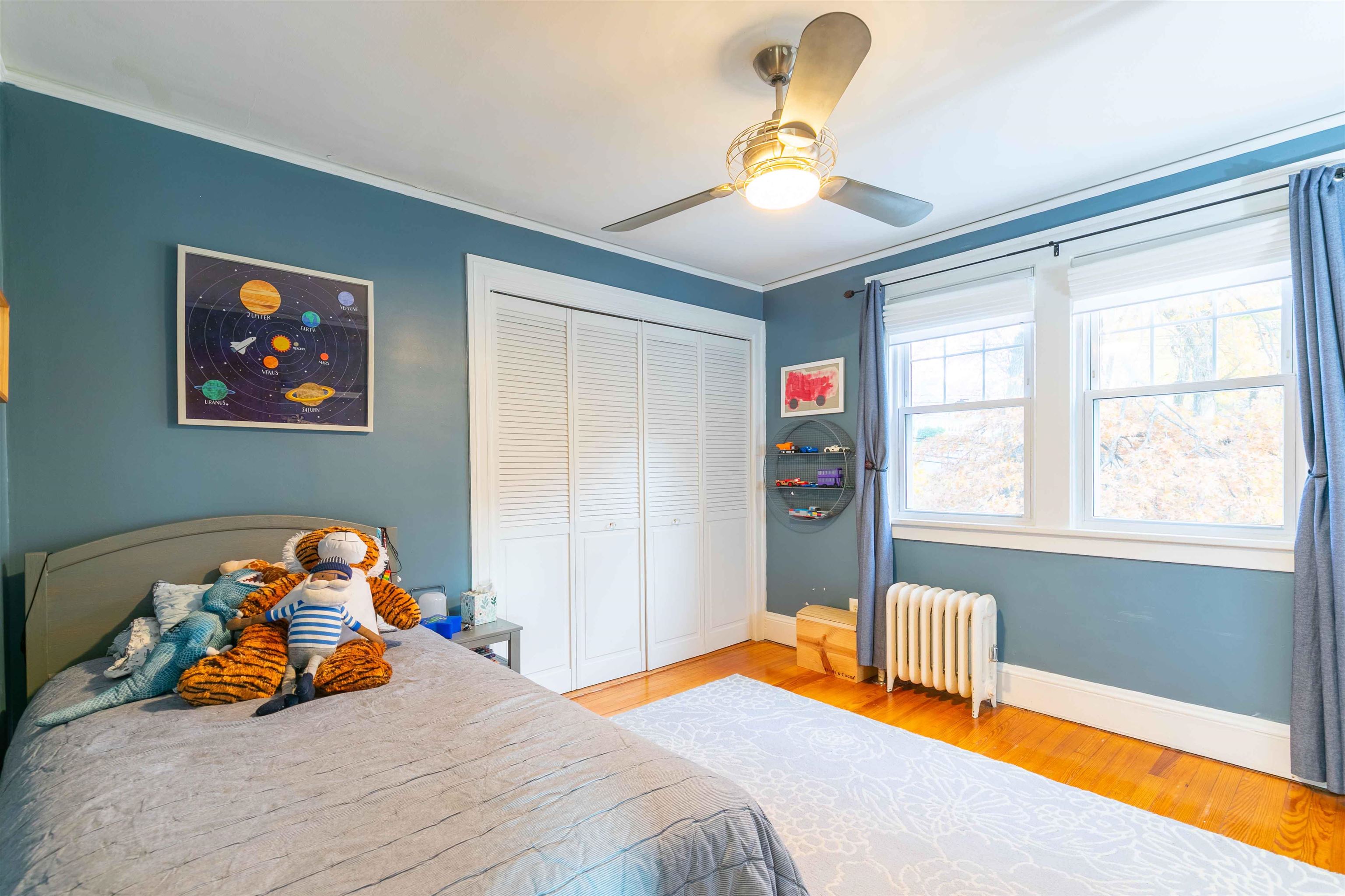 78 Jackson Avenue Rutherford, NJ 07070 - Photo 21 of 36 a bedroom with a bed and a window