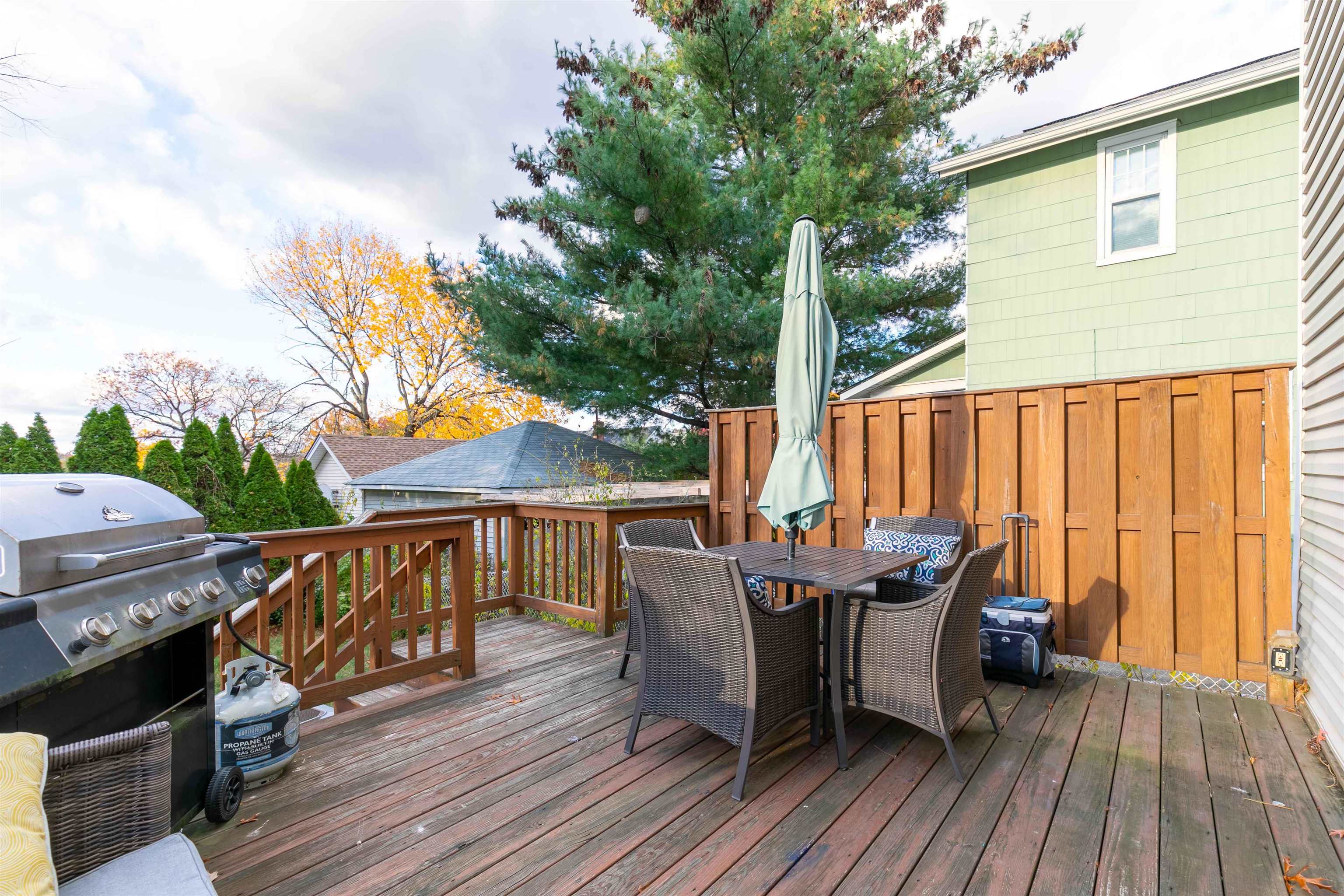 78 Jackson Avenue Rutherford, NJ 07070 - Photo 30 of 36 a view of a deck with furniture and trees