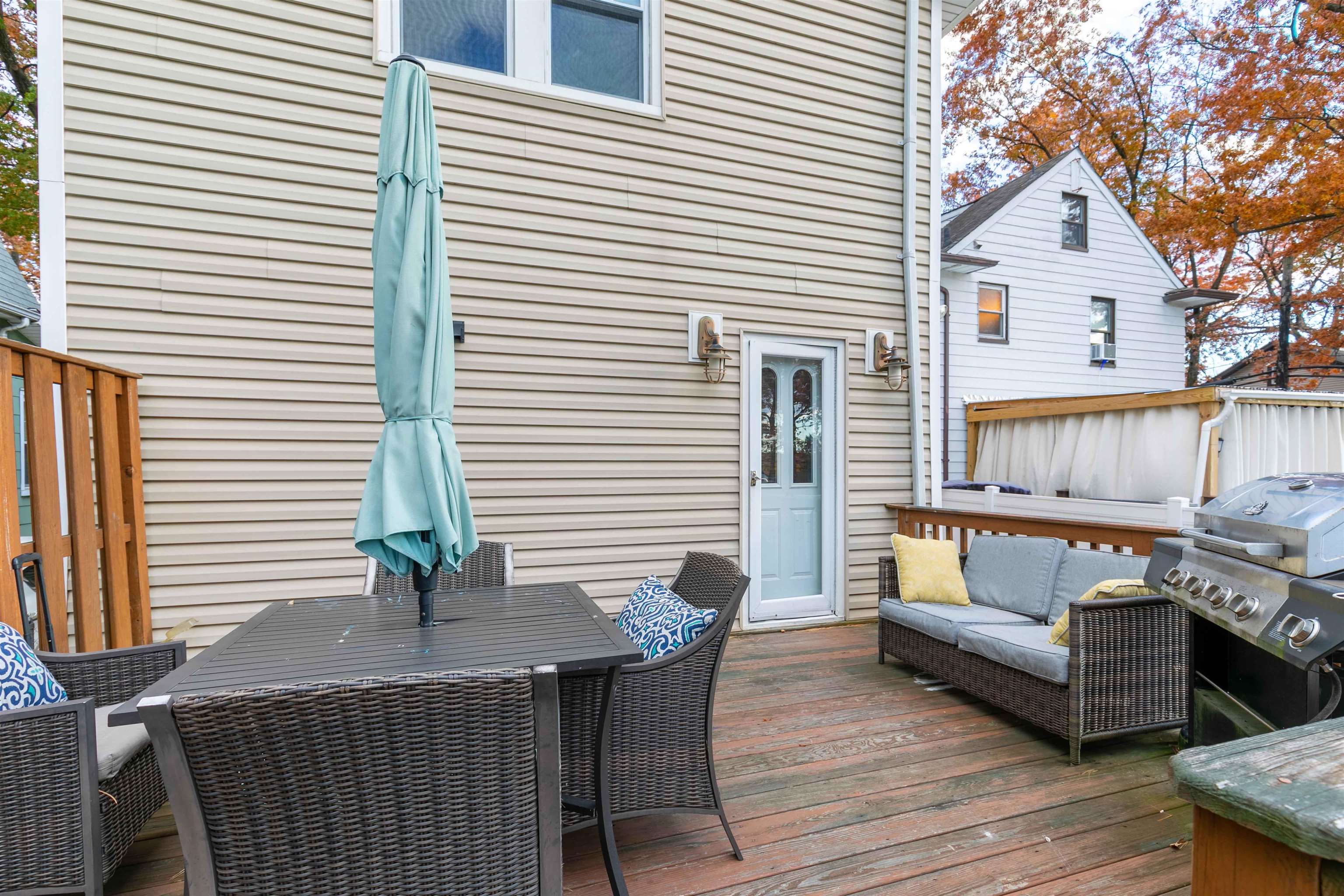 78 Jackson Avenue Rutherford, NJ 07070 - Photo 33 of 36 a balcony with furniture and wooden floor