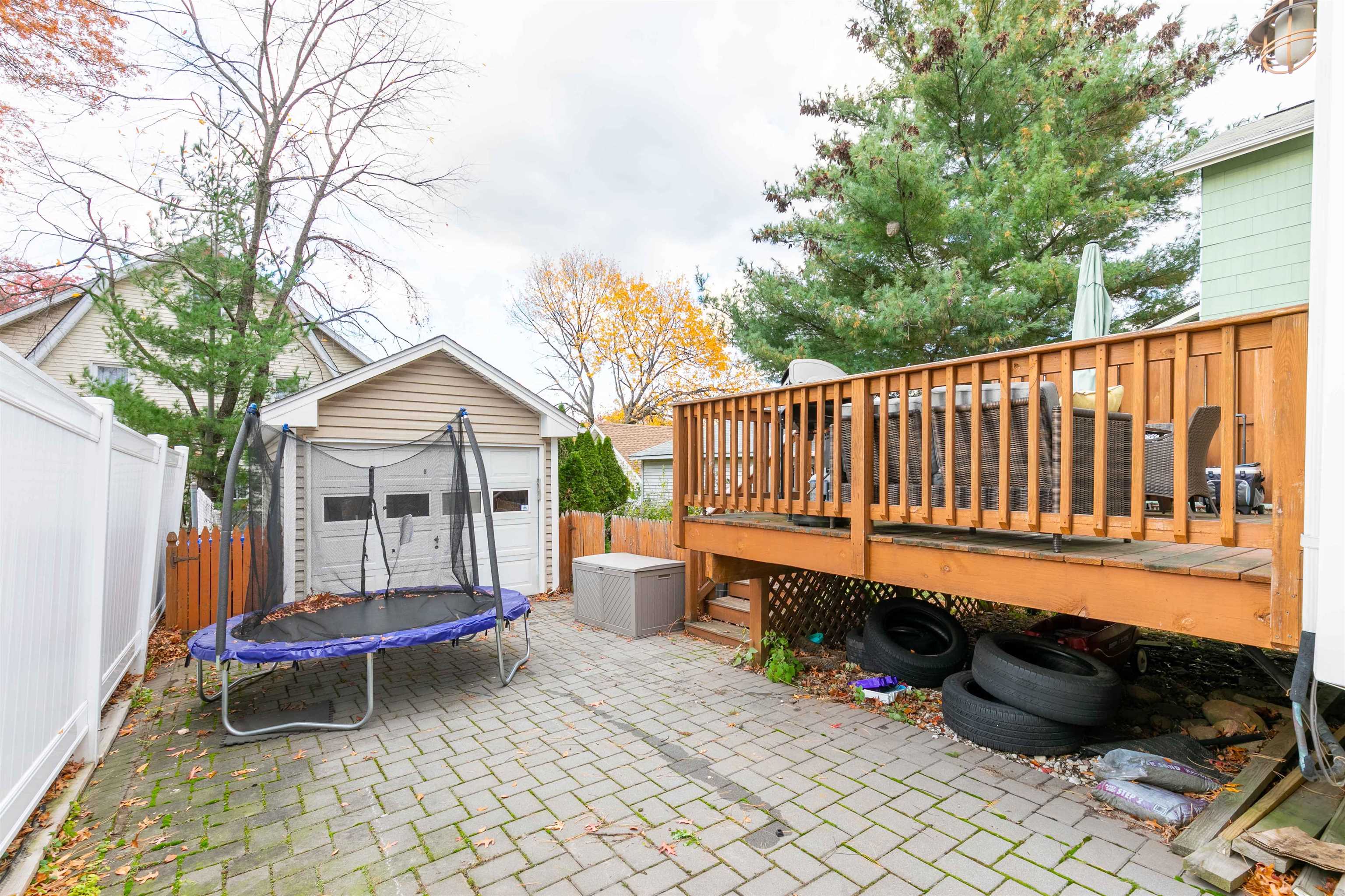 78 Jackson Avenue Rutherford, NJ 07070 - Photo 34 of 36 a street view with a sitting space and garden