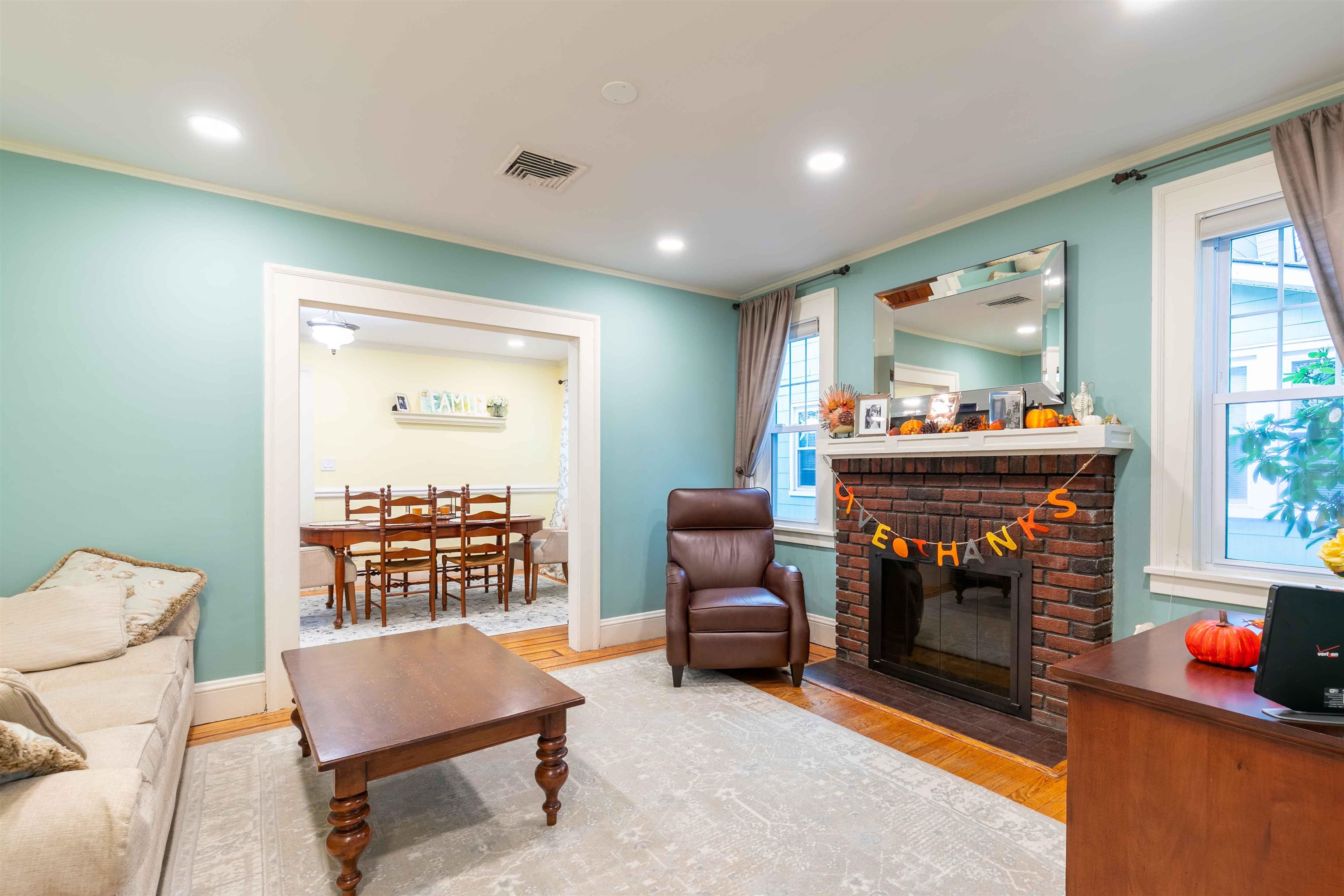 78 Jackson Avenue Rutherford, NJ 07070 - Photo 6 of 36 a living room with furniture and a fireplace