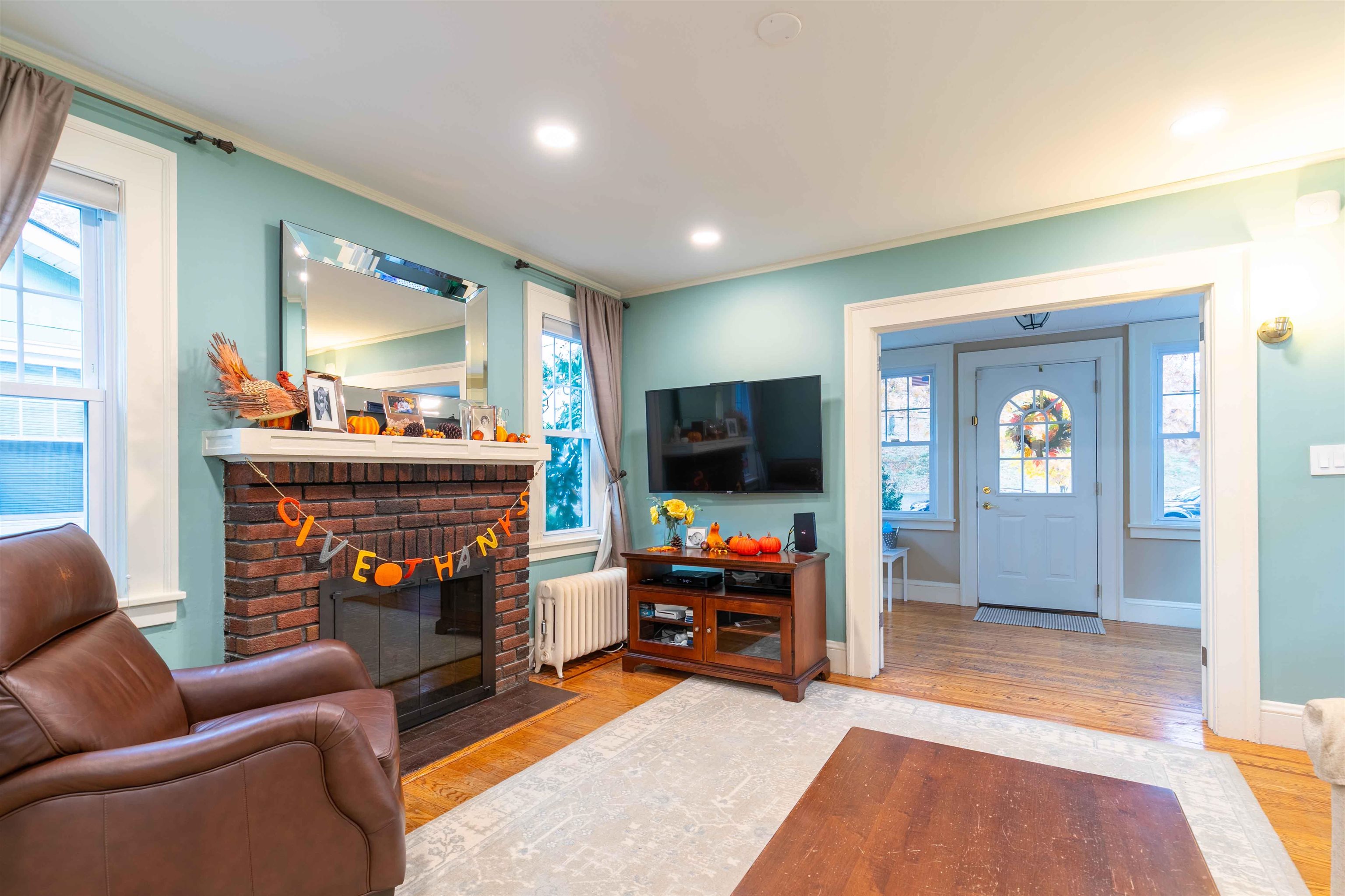 78 Jackson Avenue Rutherford, NJ 07070 - Photo 8 of 36 a children room with furniture and a flat screen tv