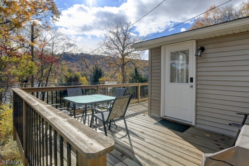 9 Woods Road Branchville, NJ 07826 - Photo 14 of 22 a balcony with wooden floor and outdoor seating