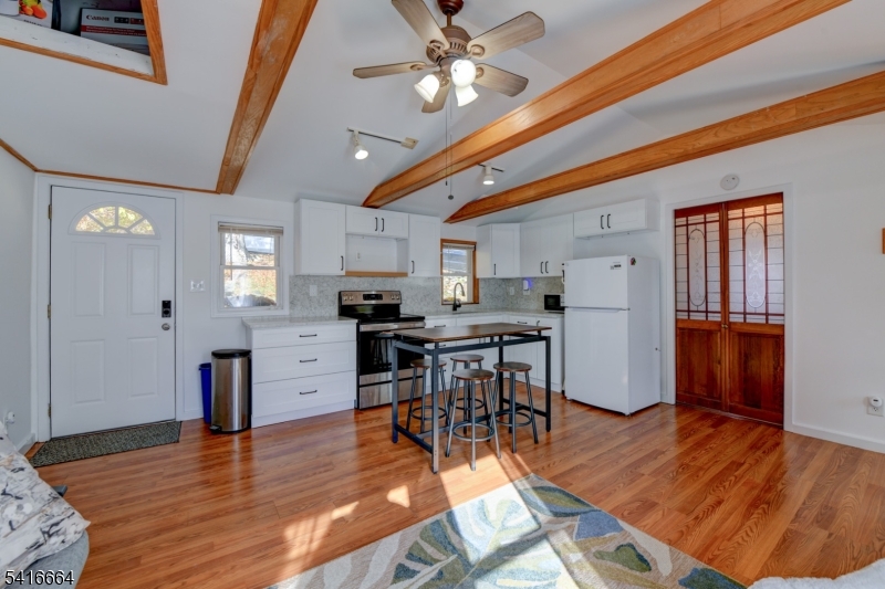9 Woods Road Branchville, NJ 07826 - Photo 4 of 22 a view of kitchen with cabinets and wooden floor