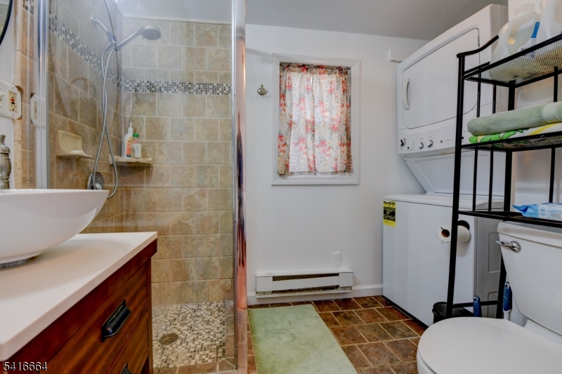 9 Woods Road Branchville, NJ 07826 - Photo 8 of 22 a bathroom with a sink toilet and shower