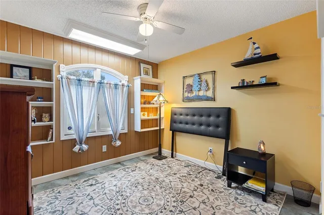 a bedroom with bed and a window