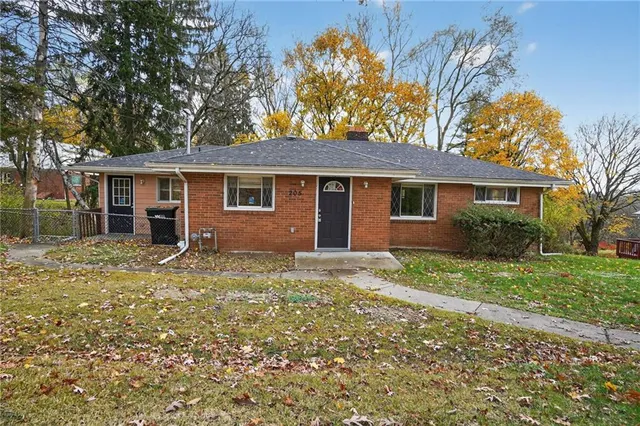 front view of a house with a yard