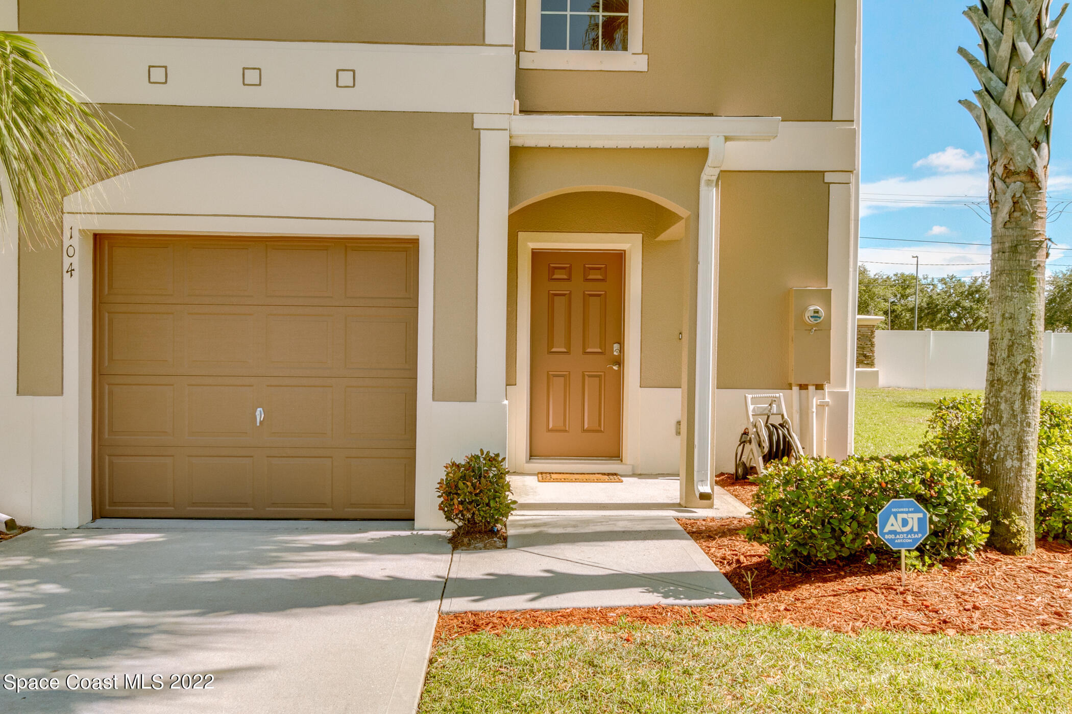 2525 Revolution Street, Unit 104 Melbourne, FL 32935 - Photo 9 of 37 a front view of a house with a outdoor space