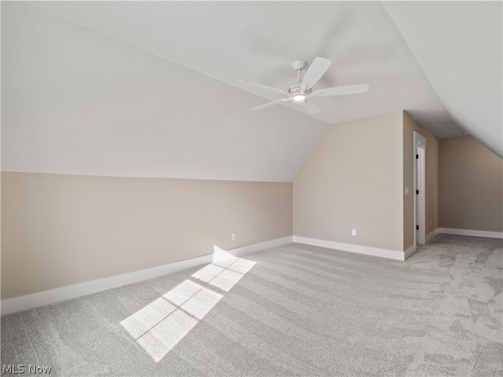 34270 Brookside Lane North Ridgeville, OH 44039 - Photo 42 of 50 Additional living space featuring light carpet, a ceiling fan, and vaulted ceiling