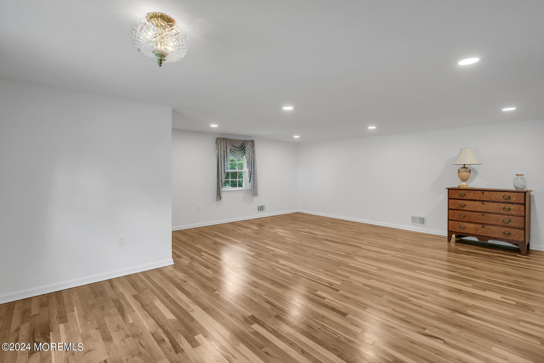 36 Maple Drive Colts Neck, NJ 07722 - Photo 17 of 32 a view of empty room with wooden floor