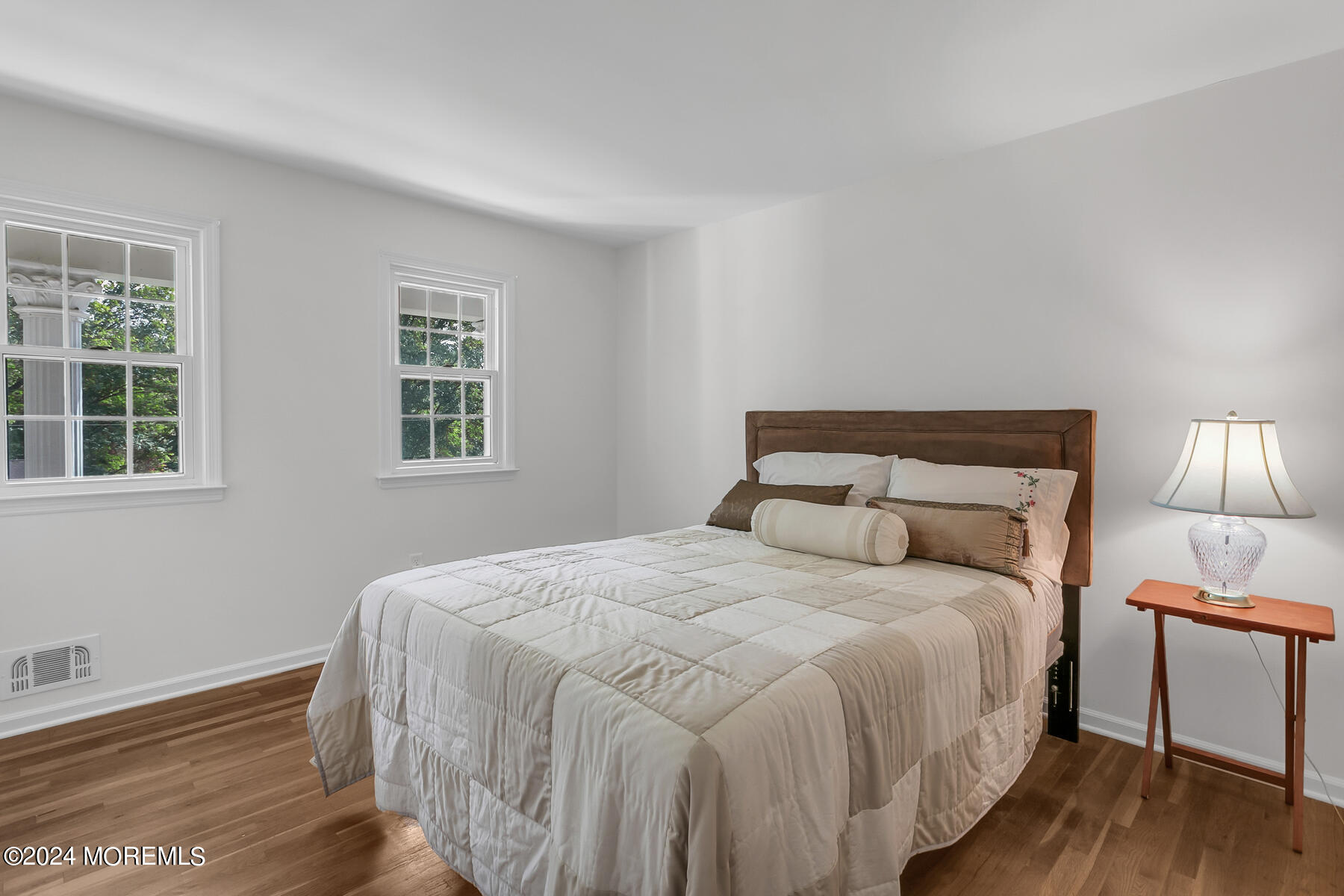 36 Maple Drive Colts Neck, NJ 07722 - Photo 19 of 32 a bedroom with a bed and wooden floor