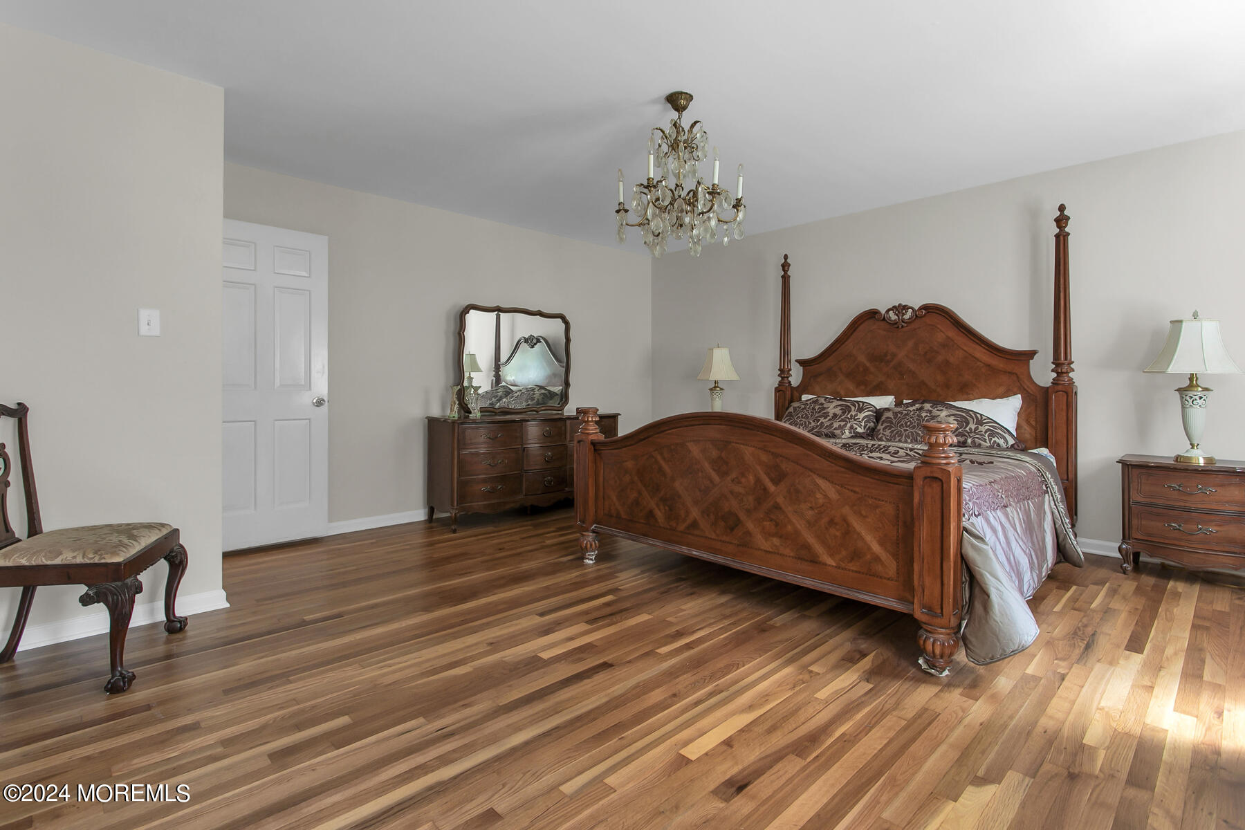 36 Maple Drive Colts Neck, NJ 07722 - Photo 23 of 32 a bedroom with a bed and wooden floor