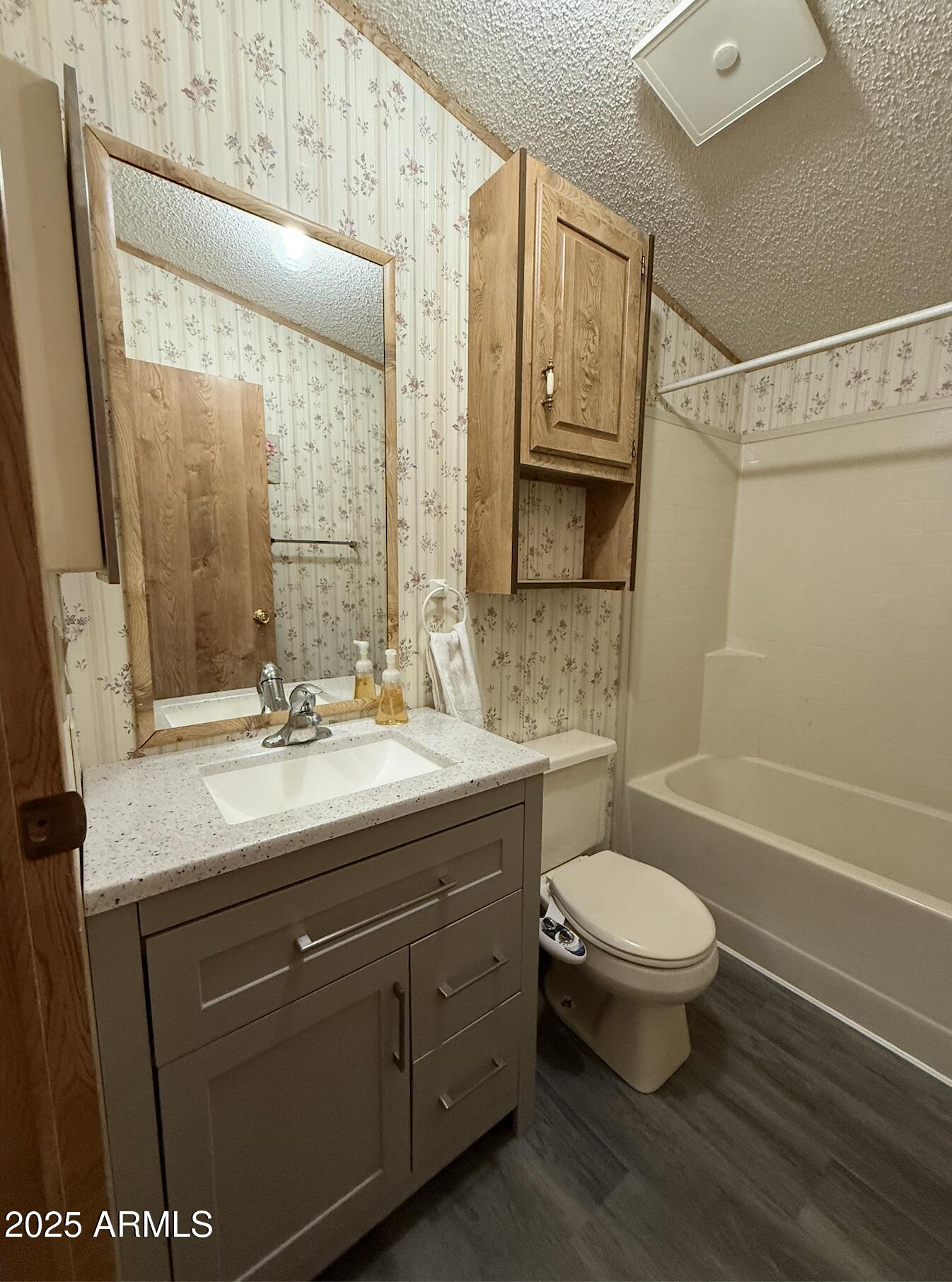 1935 North Tortoise Trail Dragoon, AZ 85609 - Photo 12 of 23 a bathroom with a sink toilet a mirror and shower