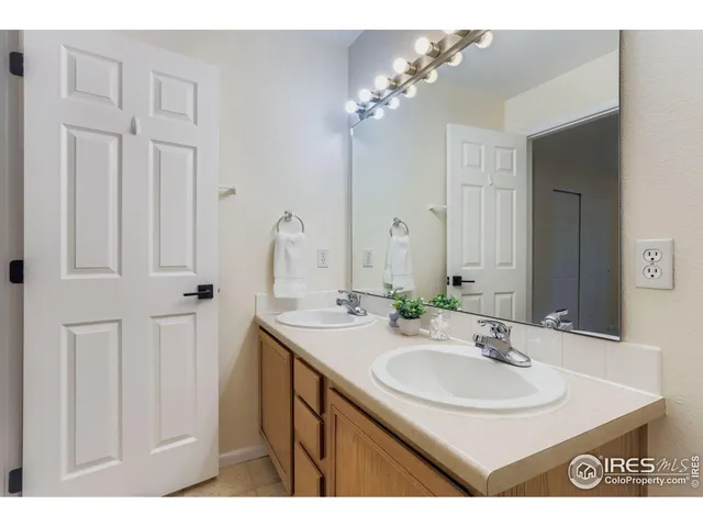 a bathroom with a sink vanity and a mirror