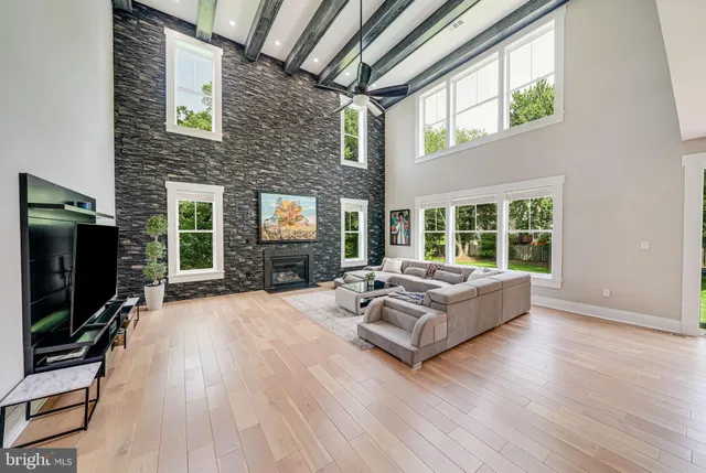 a kitchen with stainless steel appliances kitchen island granite countertop a refrigerator and microwave