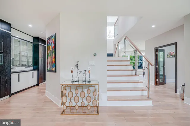 a spacious bedroom with a bed and a large window