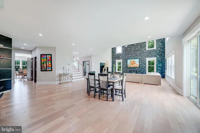 a spacious bedroom with a bed and a large window with outer view