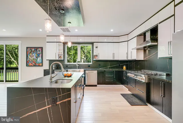 a living room with furniture a window and a flat screen tv