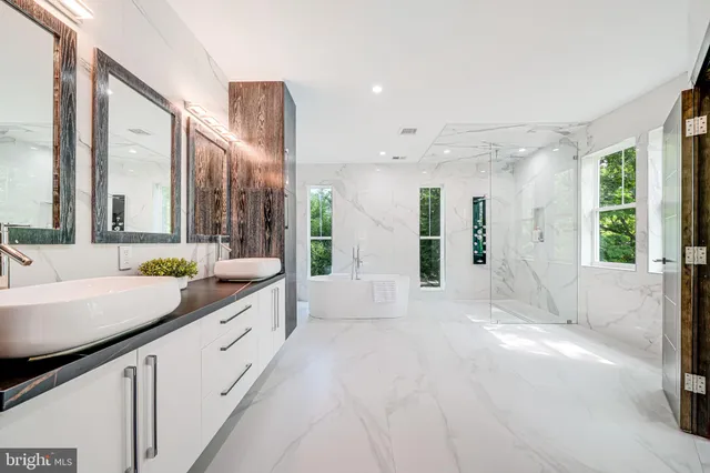 a bathroom with a double vanity sink and a mirror