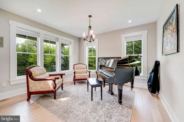 a living room with fireplace furniture and a flat screen tv