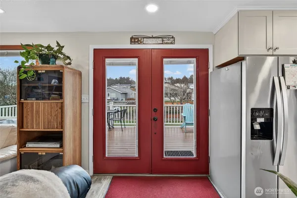 a bathroom with a bathtub and double sink