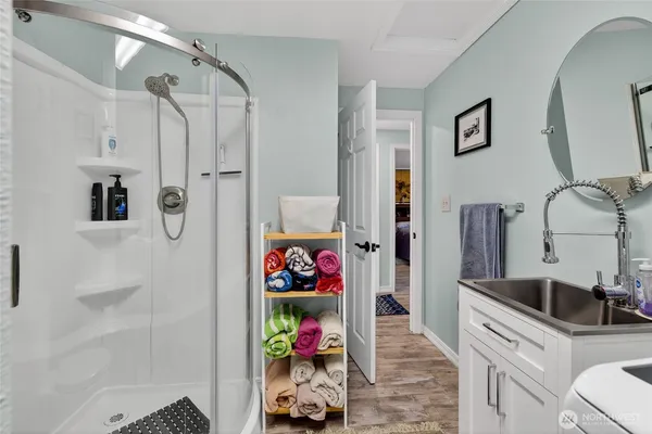 a front view of a house with a garden and yard