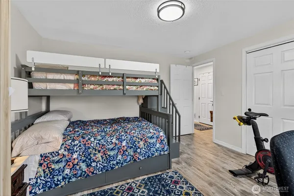 an aerial view of a house with a yard and black garden