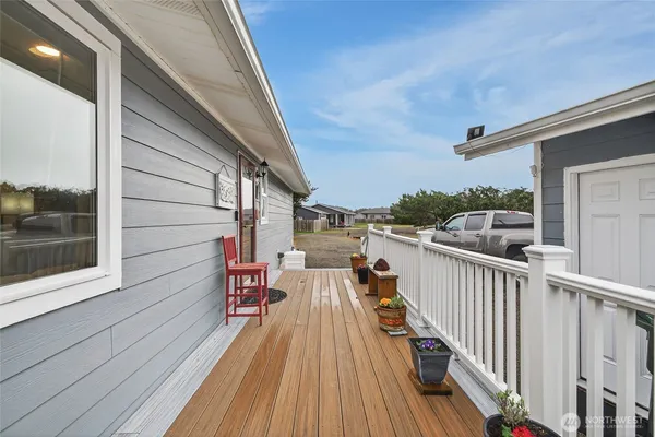a view of a dining room with furniture wooden floor and a chandelier