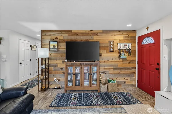 a kitchen with stainless steel appliances granite countertop a stove sink microwave and cabinets