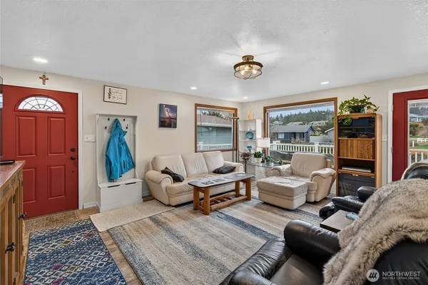 a kitchen that has a lot of cabinets a sink and appliances